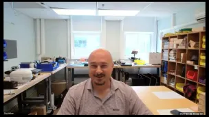 Smiling man in an office setting.