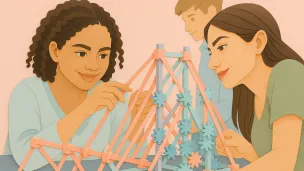 Three students construct a truss structure.