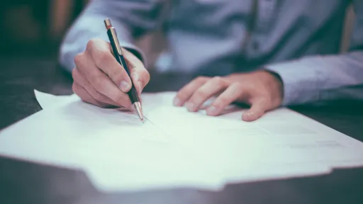 Person filling out paperwork