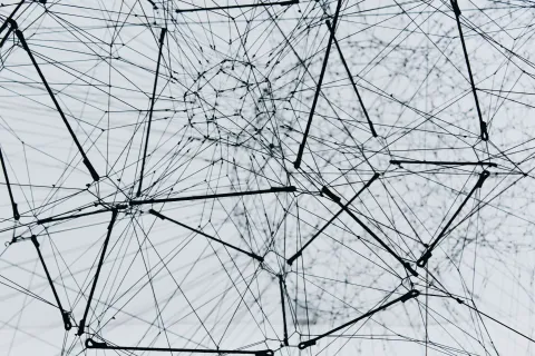 Abstract graphic of interconnected lines and nodes.