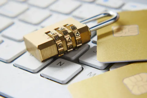 Photograph of a lock on a computer keyboard.